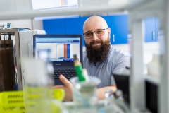 Ofman, PhD, Eng and the SBR-type biological reactor he designed, photo by Paweł Jankowski